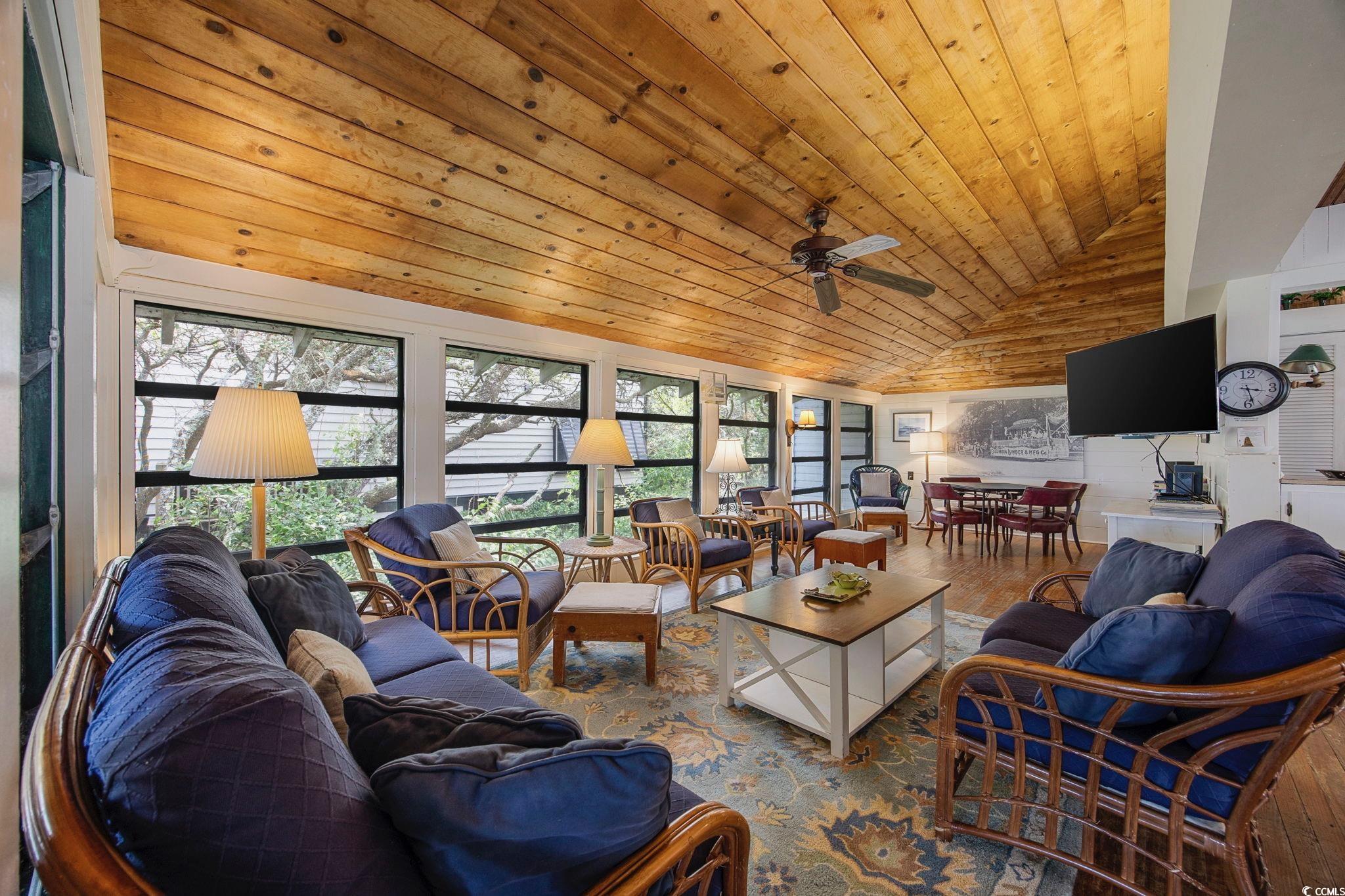 496 Myrtle Avenue Pawleys Island, SC 29585 - Photo 9 of 40 Living room with vaulted ceiling, wood ceiling, ceiling fan, and hardwood / wood-style floors