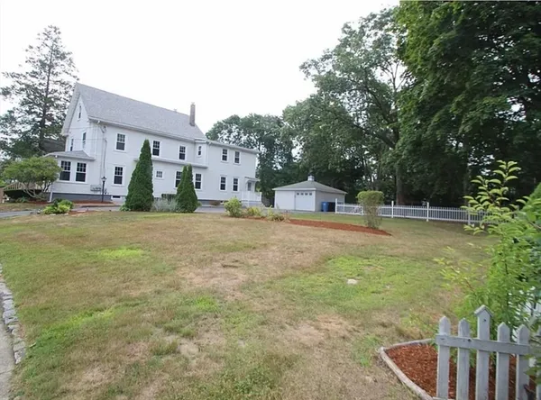 a house view with swimming pool in front of it