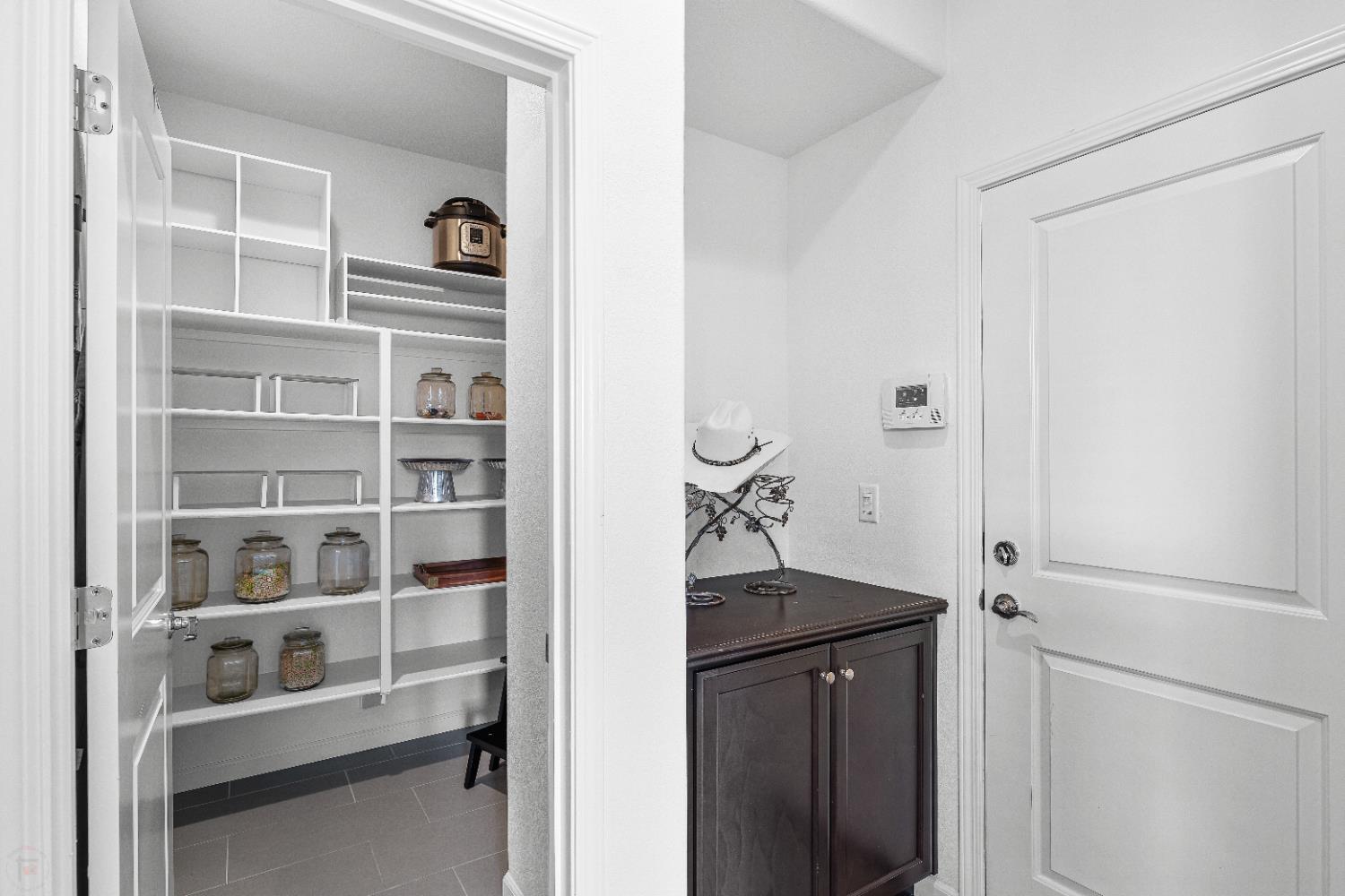 2305 Augusta Avenue Tracy, CA 95377 - Photo 25 of 91 a view of storage and utility room with racks on the wall