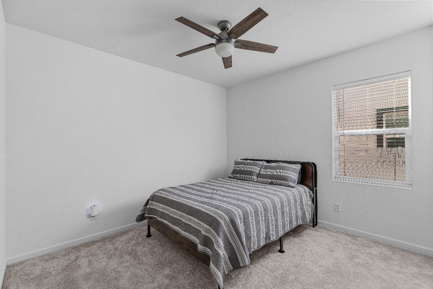 2305 Augusta Avenue Tracy, CA 95377 - Photo 36 of 91 a bedroom with a bed and a window