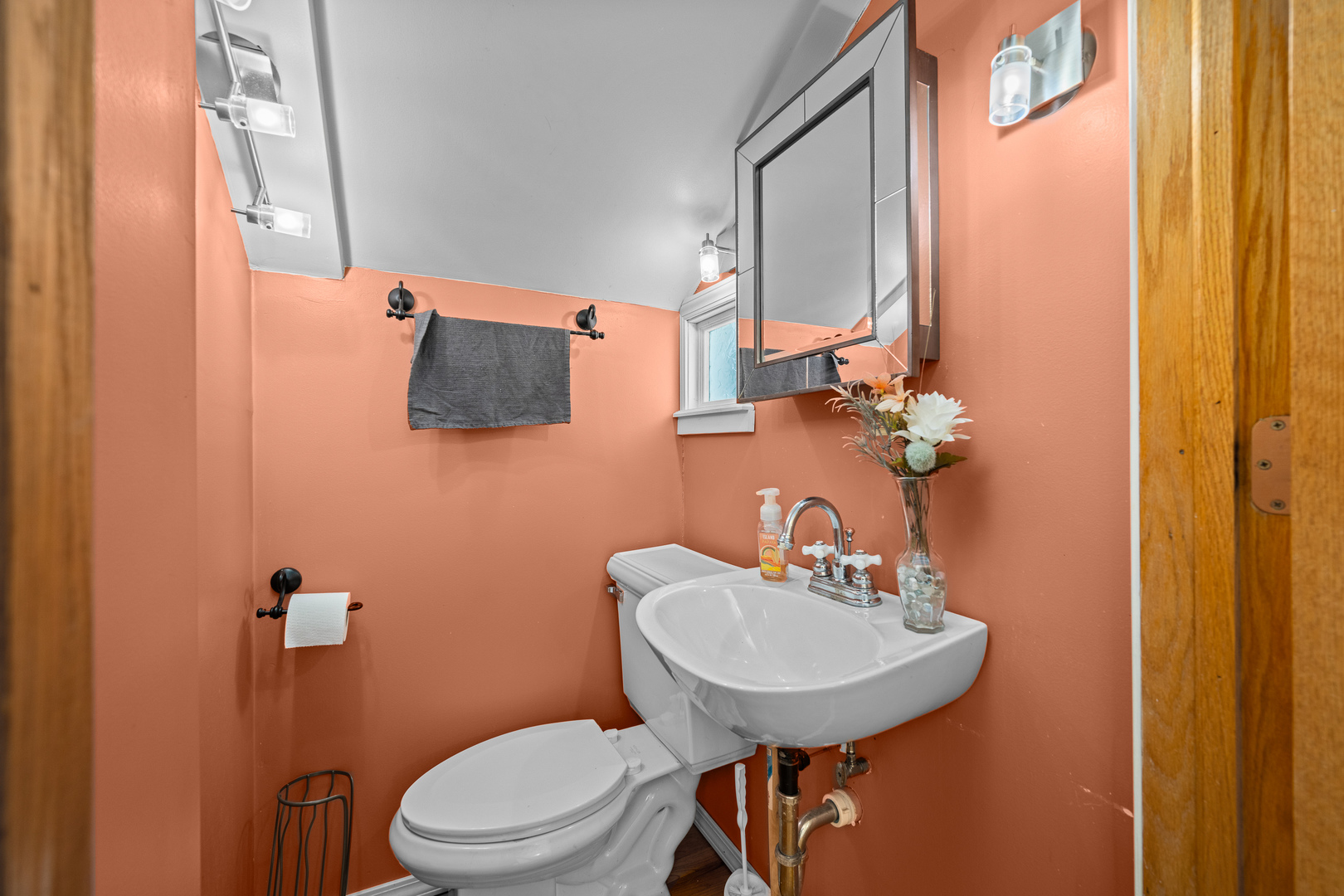 802 North High Street Port Byron, IL 61275 - Photo 27 of 43 a bathroom with a sink a toilet and mirror