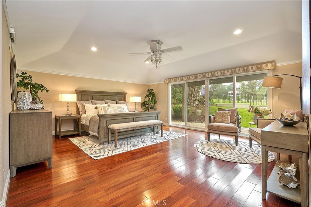 8652 Los Coyotes Drive Buena Park, CA 90621 - Photo 24 of 72 a living room with furniture large windows and wooden floor