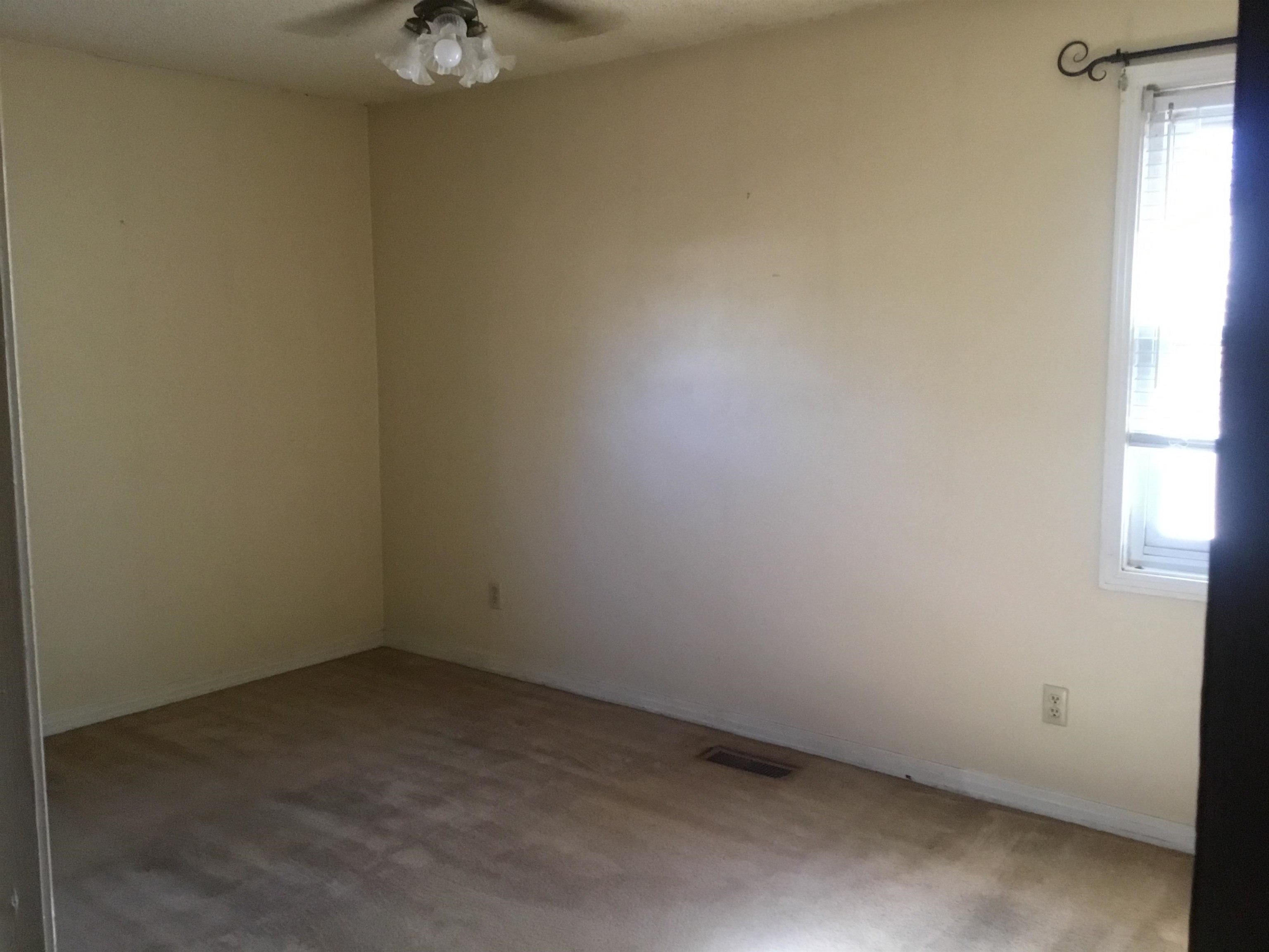 367 Crabtree Road Selmer, TN 38375 - Photo 10 of 23 Empty room featuring a ceiling fan and carpet floors