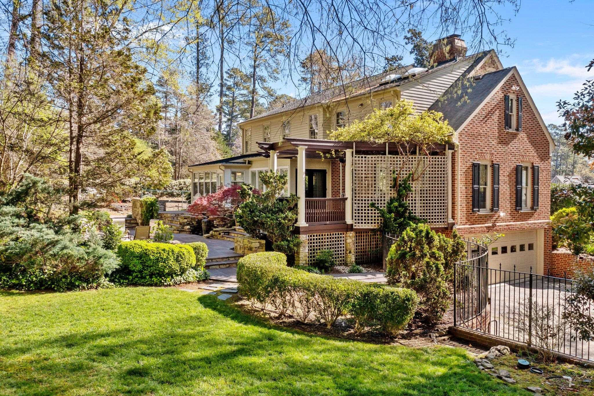 a view of a house with a yard and plants