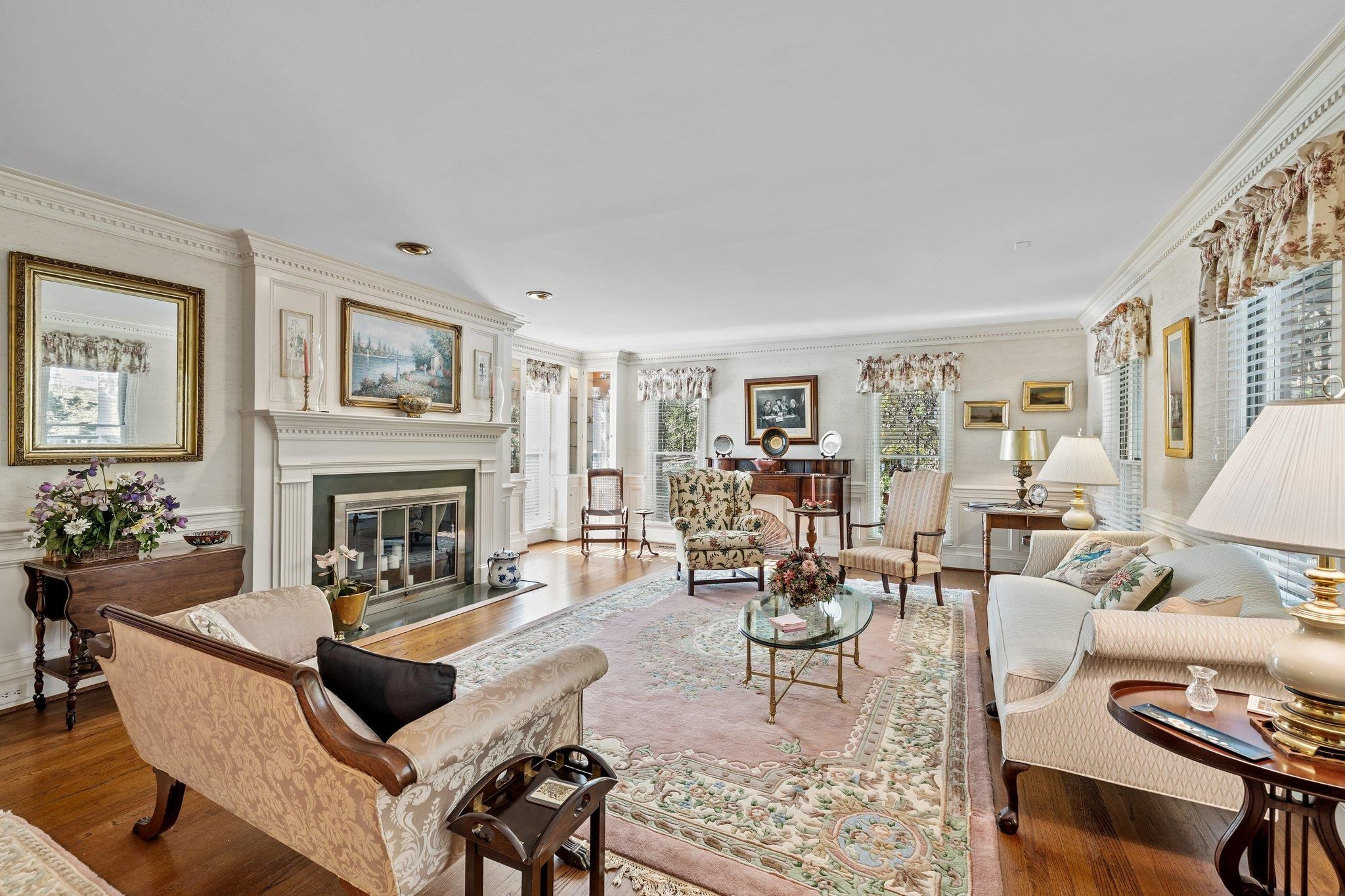 3608 Dover Road Durham, NC 27707 - Photo 11 of 60 a living room with furniture a fireplace and a table