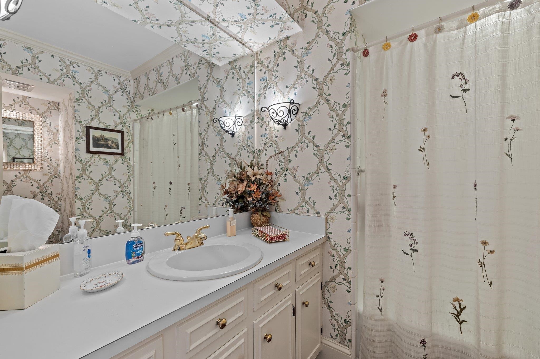 3608 Dover Road Durham, NC 27707 - Photo 15 of 60 a bathroom with shower sink and a mirror
