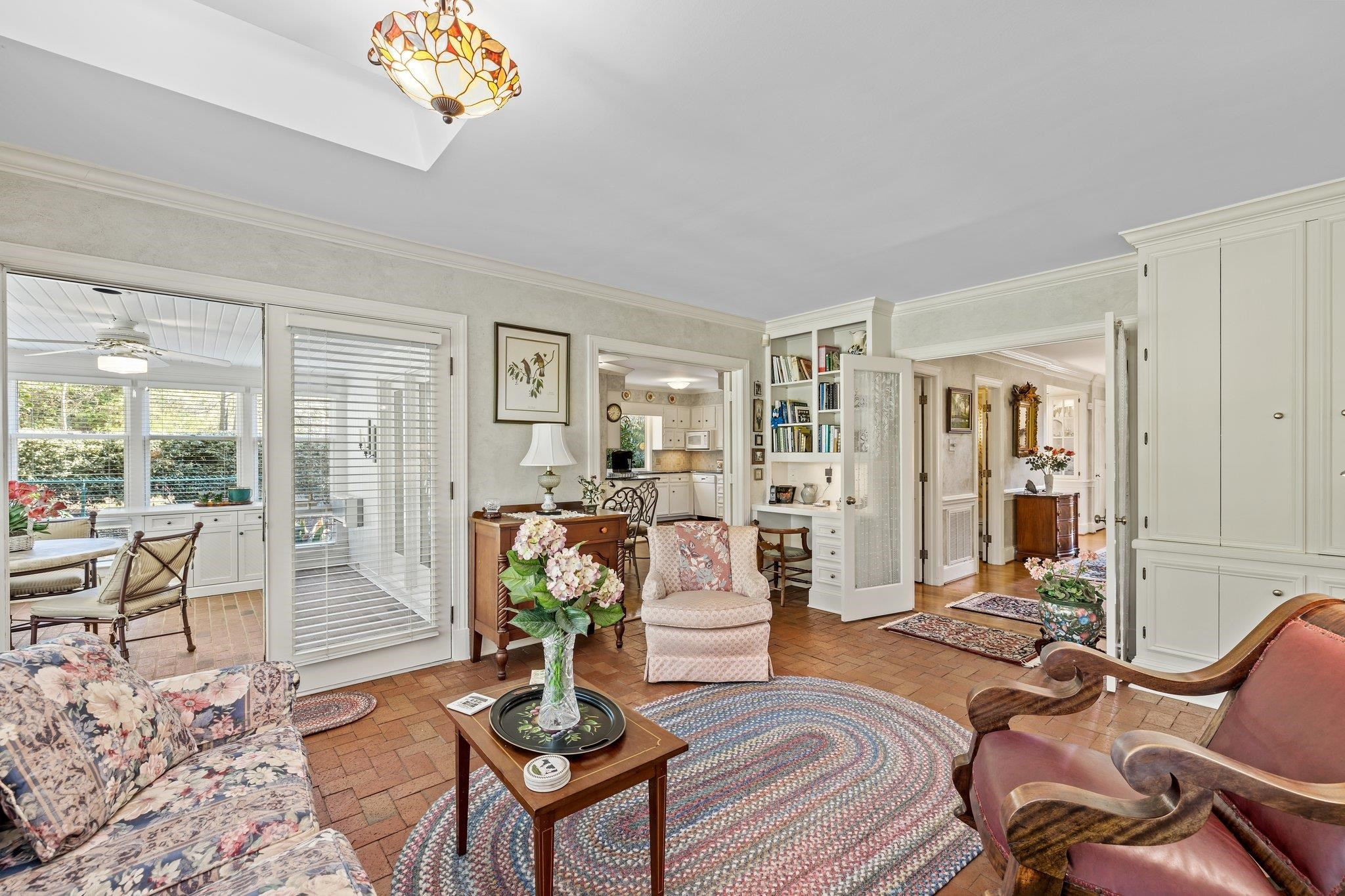 3608 Dover Road Durham, NC 27707 - Photo 18 of 60 a living room with furniture a table and wooden floor