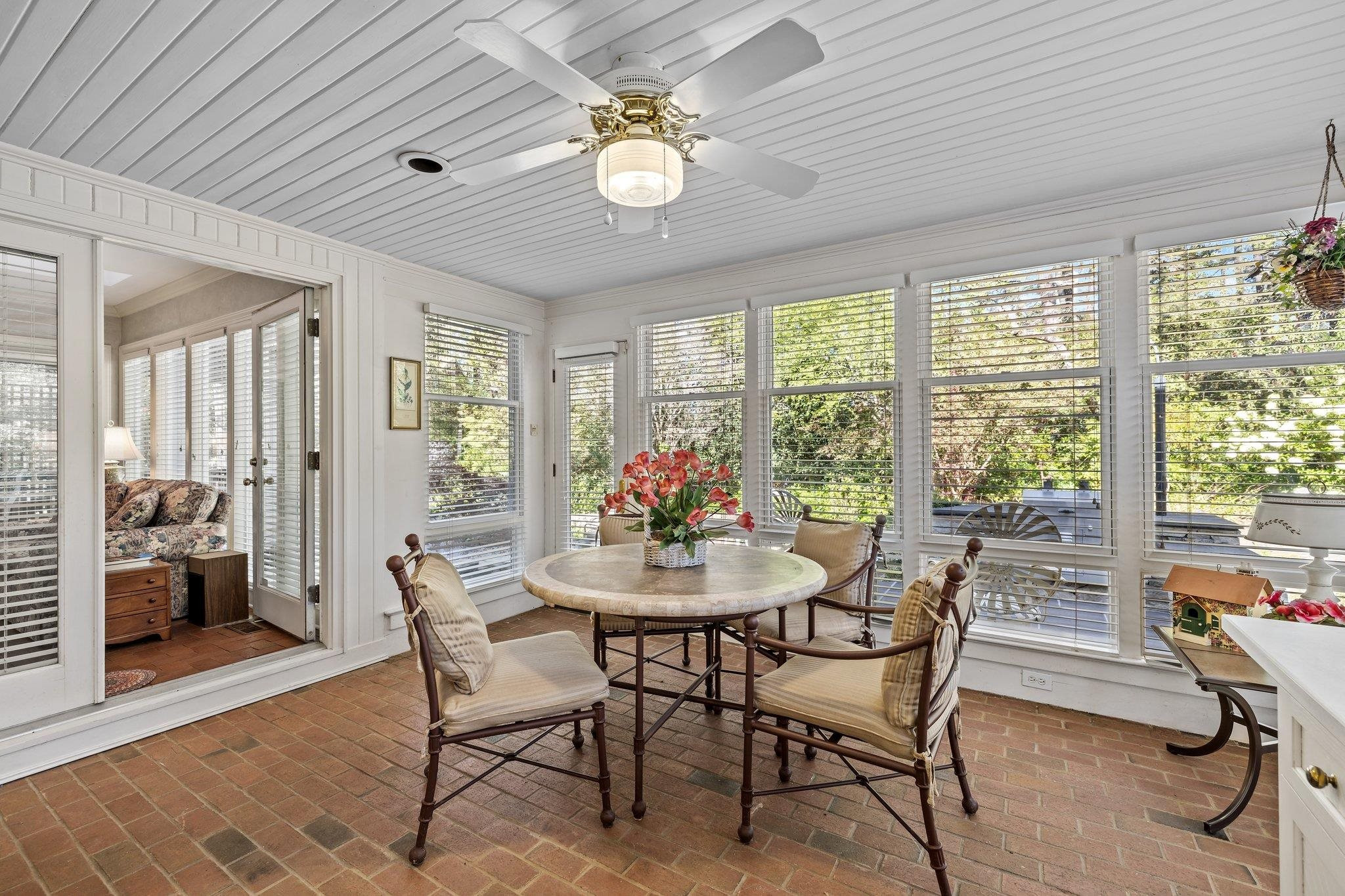 3608 Dover Road Durham, NC 27707 - Photo 19 of 60 a dining room with furniture a chandelier and wooden floor