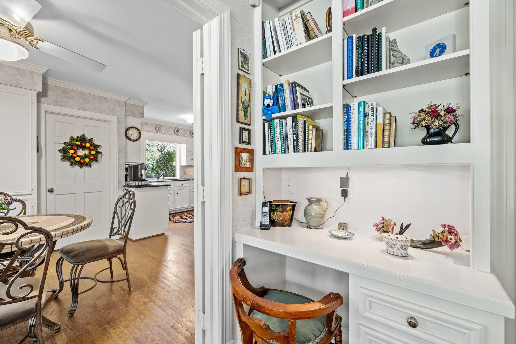 3608 Dover Road Durham, NC 27707 - Photo 21 of 60 a workspace with furniture and book shelf