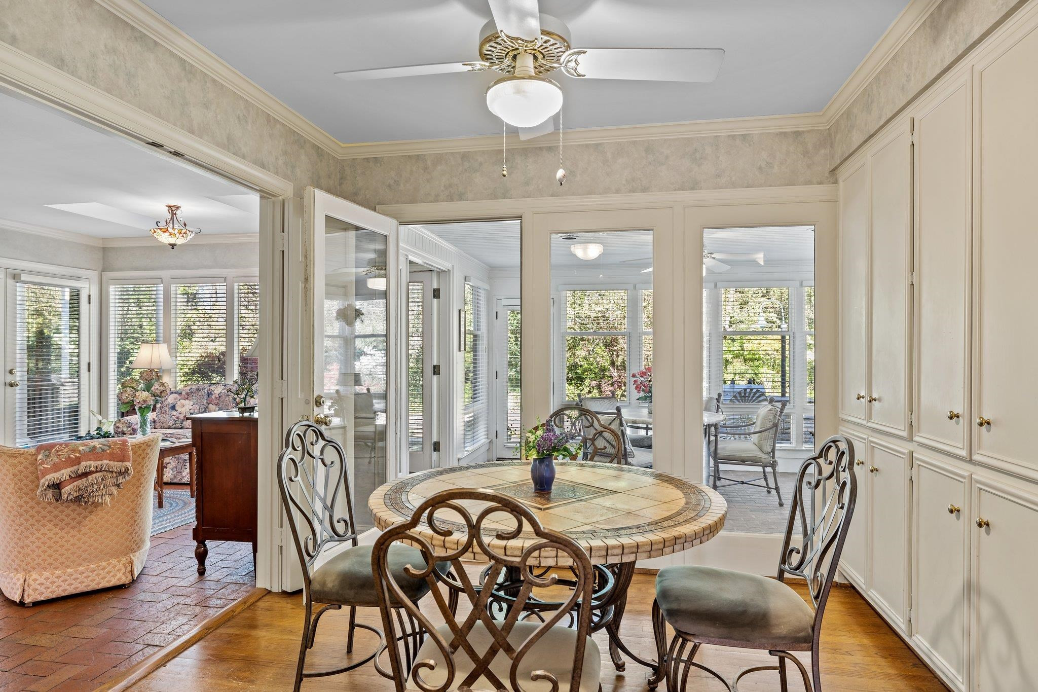 3608 Dover Road Durham, NC 27707 - Photo 23 of 60 a view of a dining room with furniture window and wooden floor