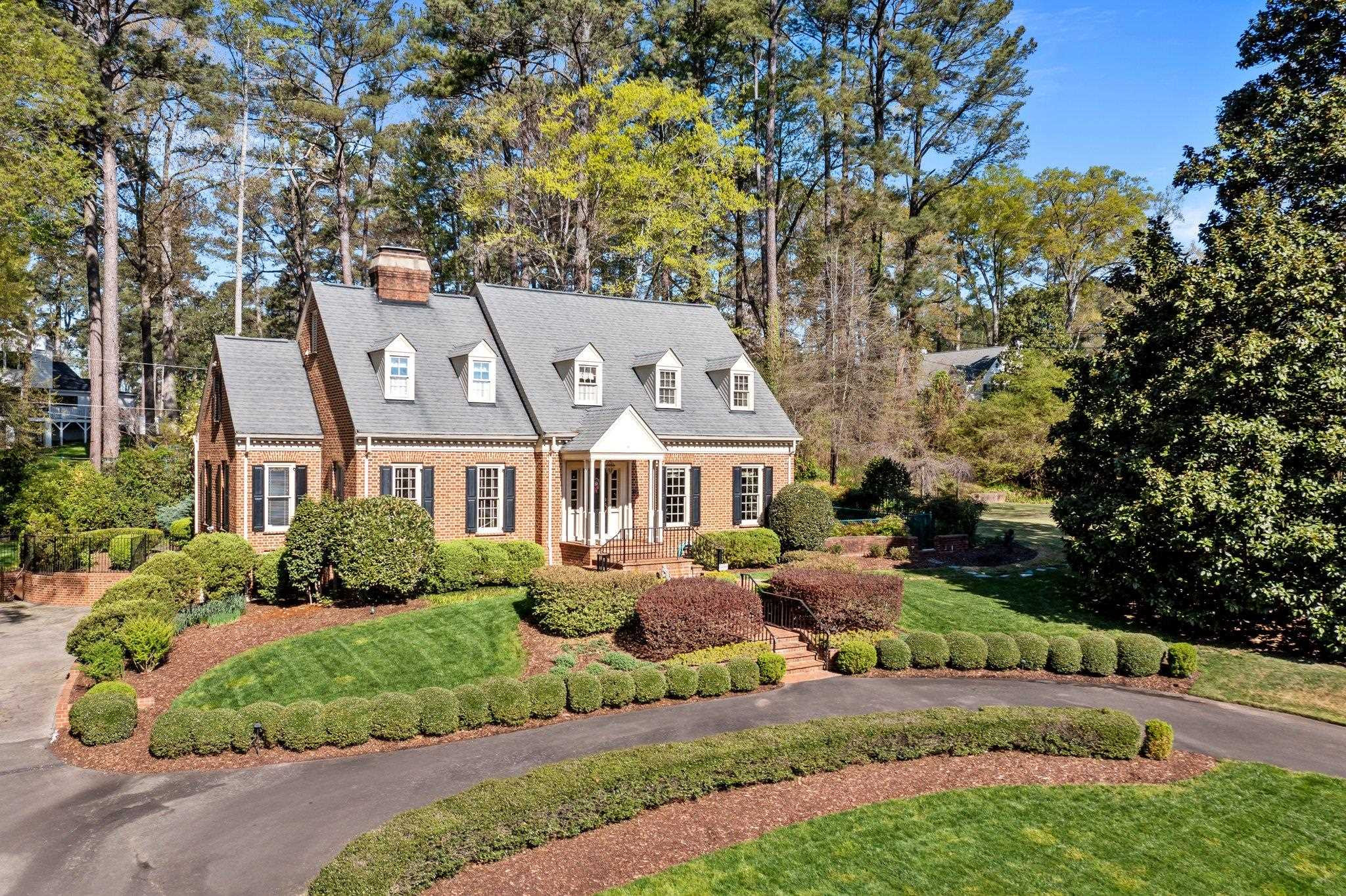3608 Dover Road Durham, NC 27707 - Photo 27 of 60 a front view of a house with a garden