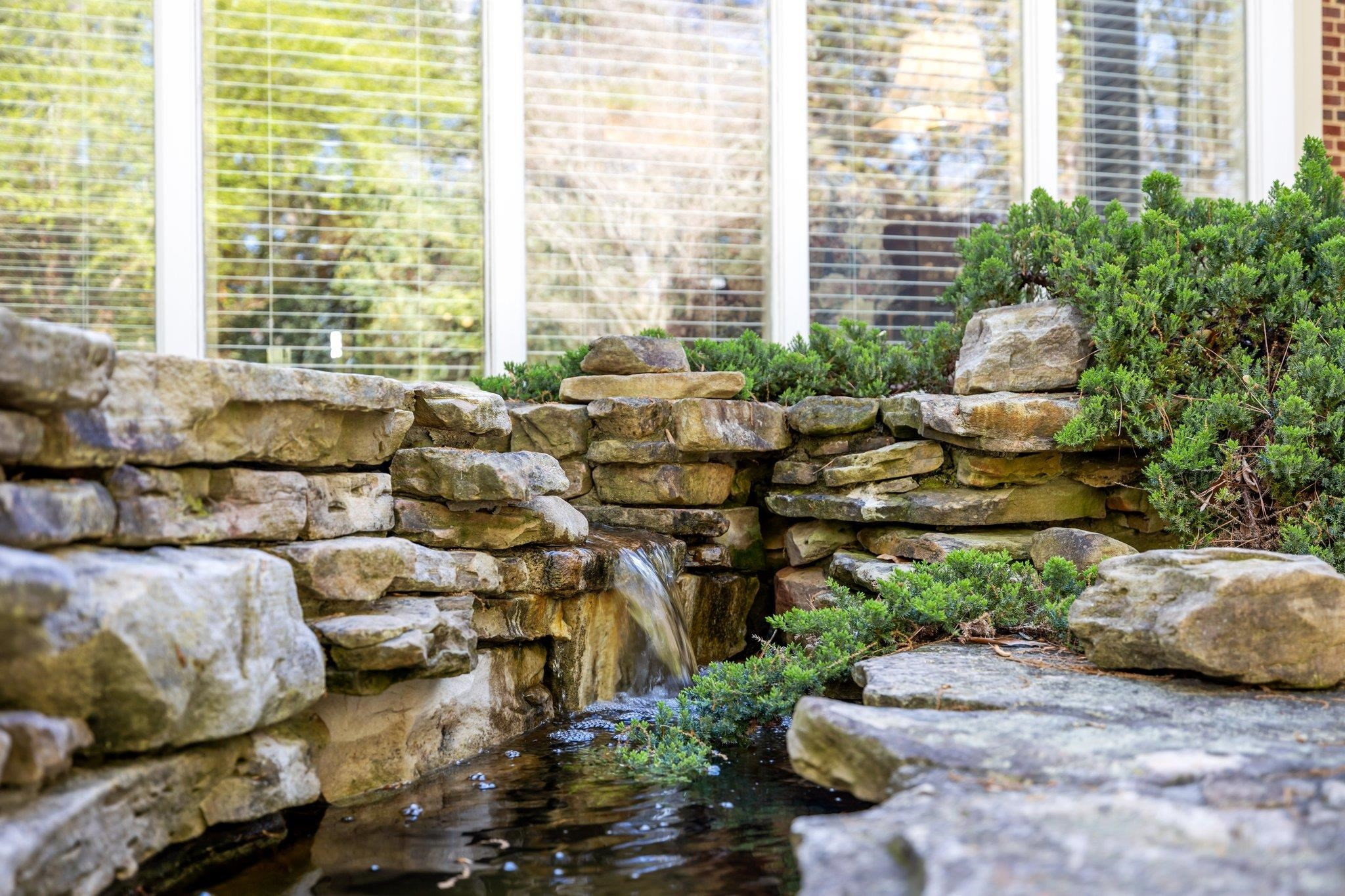 3608 Dover Road Durham, NC 27707 - Photo 36 of 60 a living room with furniture and a floor to ceiling window