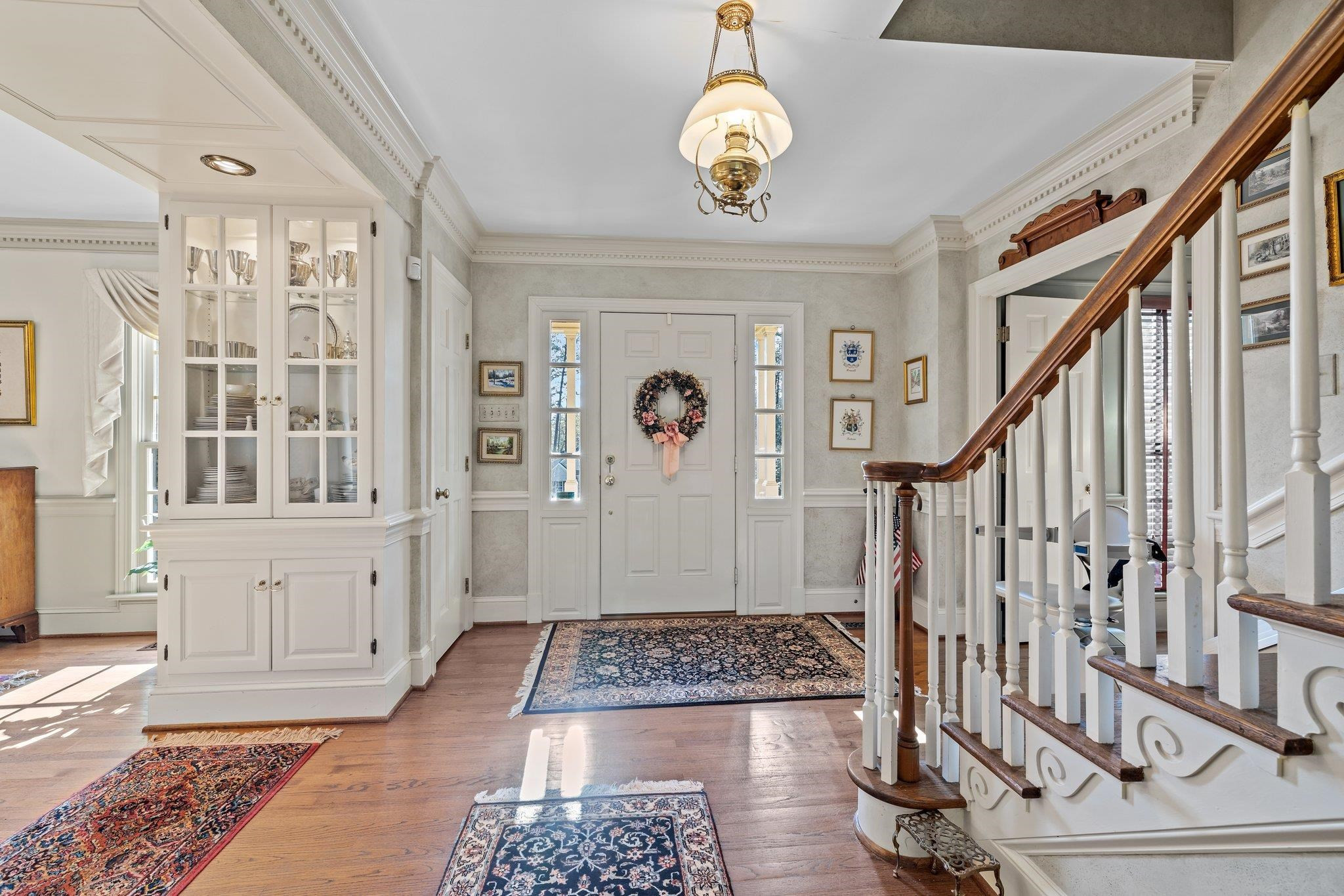 3608 Dover Road Durham, NC 27707 - Photo 4 of 60 a view of entryway with wooden floor and stair