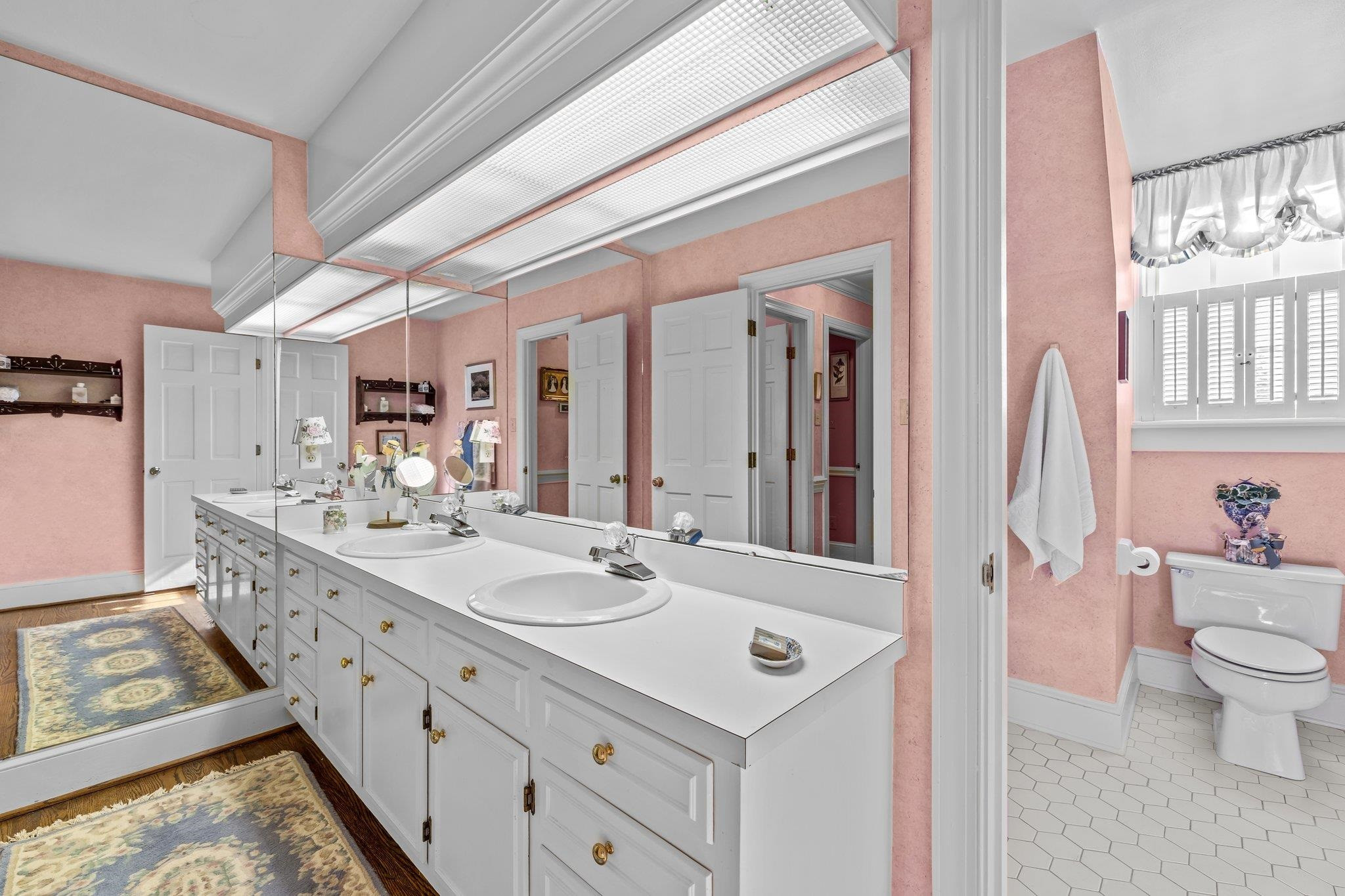 3608 Dover Road Durham, NC 27707 - Photo 46 of 60 a bathroom with a double vanity sink mirror and toilet