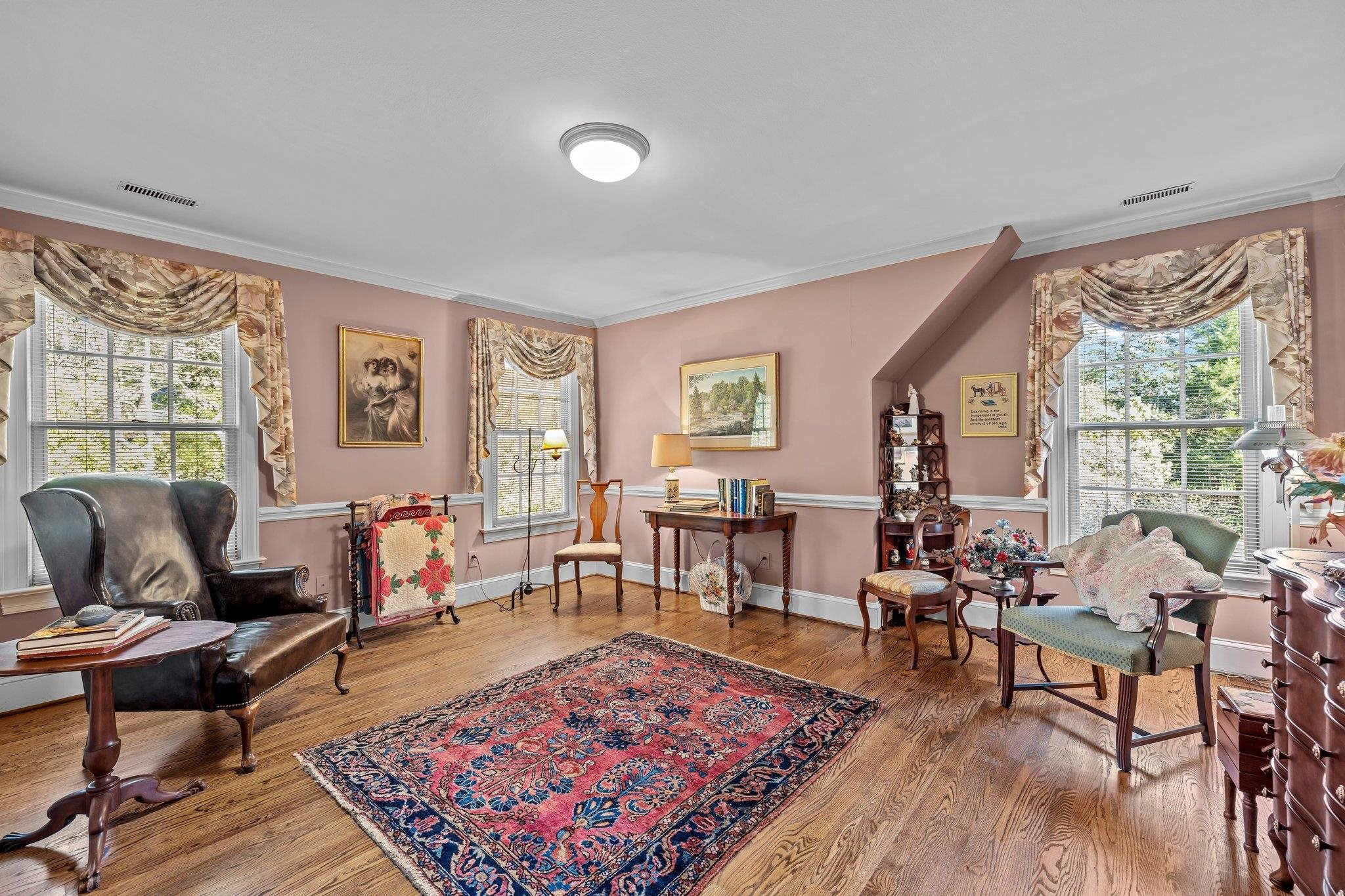 3608 Dover Road Durham, NC 27707 - Photo 48 of 60 a living room with furniture a rug a flat screen tv and a large window
