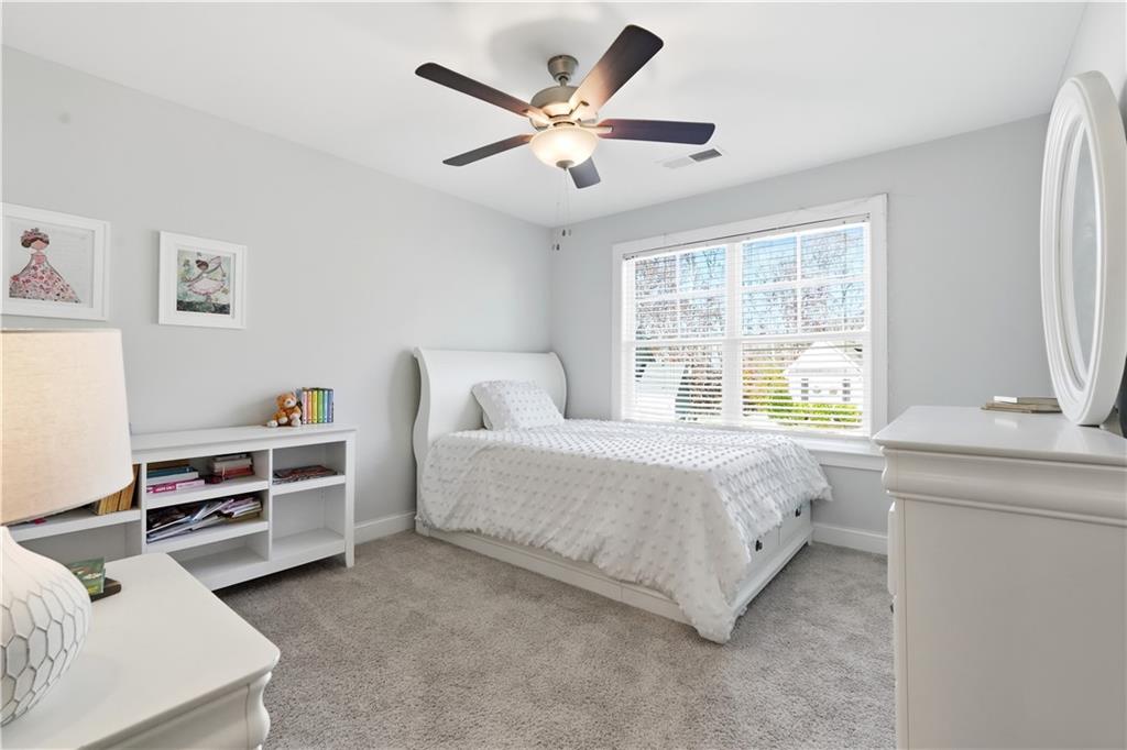 8745 Hightower Ridge Ball Ground, GA 30107 - Photo 18 of 36 a bedroom with furniture and a window