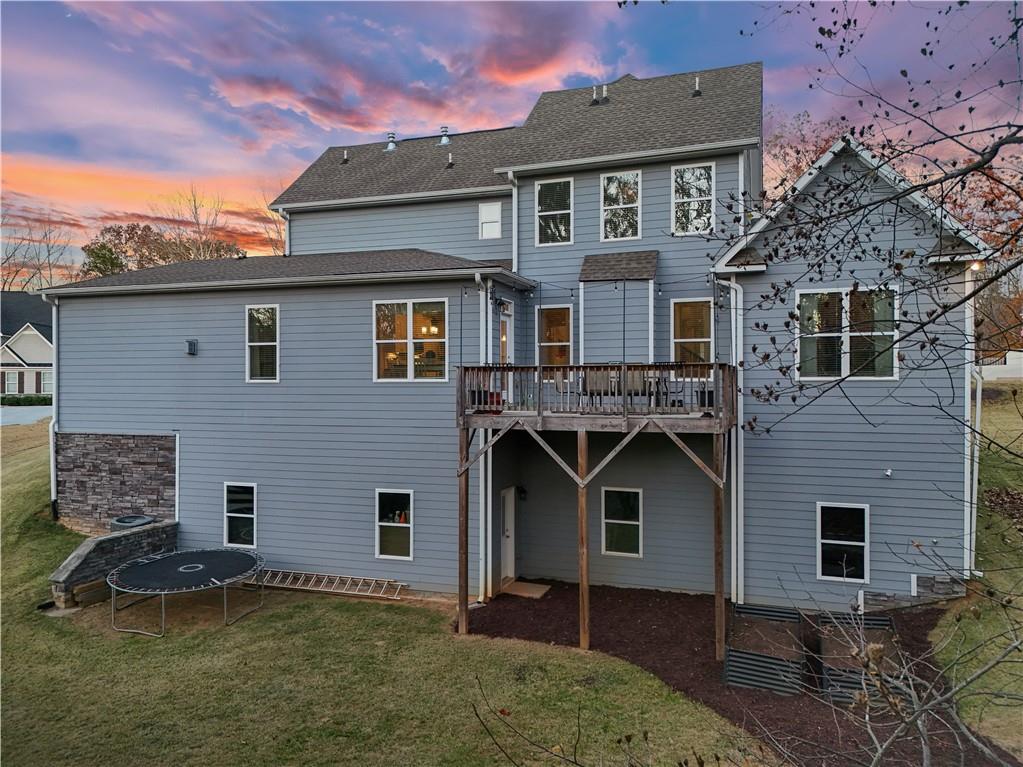 8745 Hightower Ridge Ball Ground, GA 30107 - Photo 26 of 36 a front view of a house with a yard