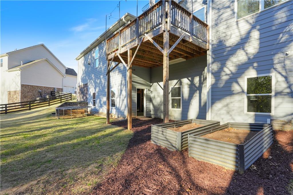 8745 Hightower Ridge Ball Ground, GA 30107 - Photo 27 of 36 a front view of a house with a yard