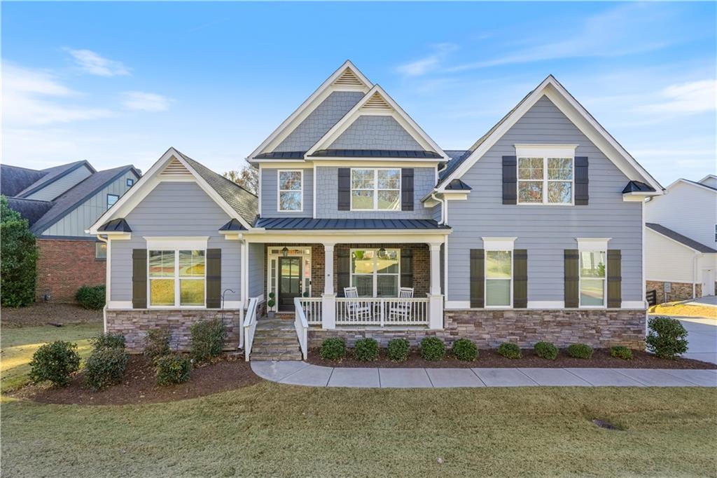 8745 Hightower Ridge Ball Ground, GA 30107 - Photo 28 of 36 a front view of a house with garden