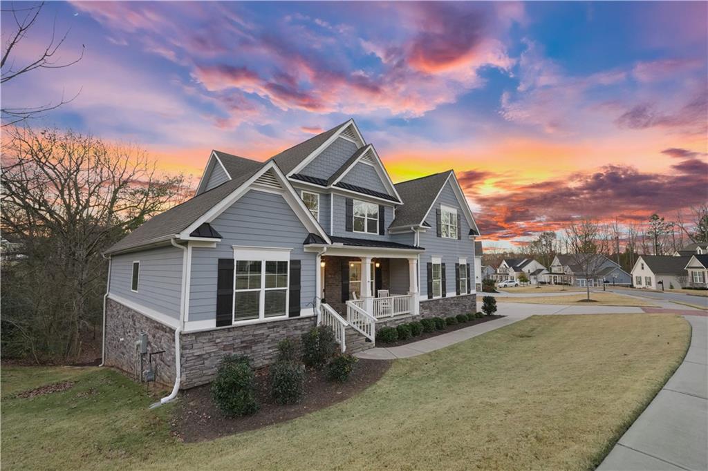 8745 Hightower Ridge Ball Ground, GA 30107 - Photo 36 of 36 front view of a house with a yard