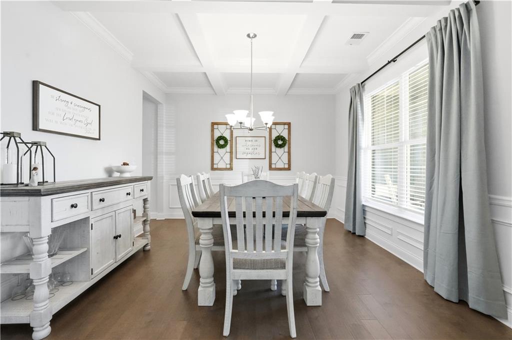 8745 Hightower Ridge Ball Ground, GA 30107 - Photo 4 of 36 a view of a dining room with furniture window and wooden floor