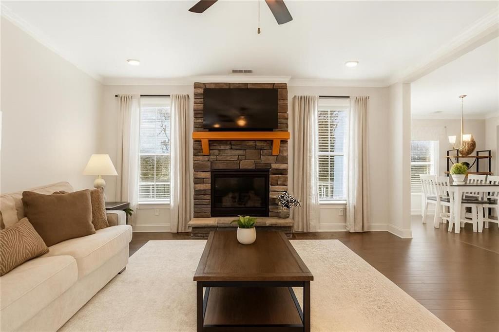 8745 Hightower Ridge Ball Ground, GA 30107 - Photo 8 of 36 a living room with furniture and a fireplace
