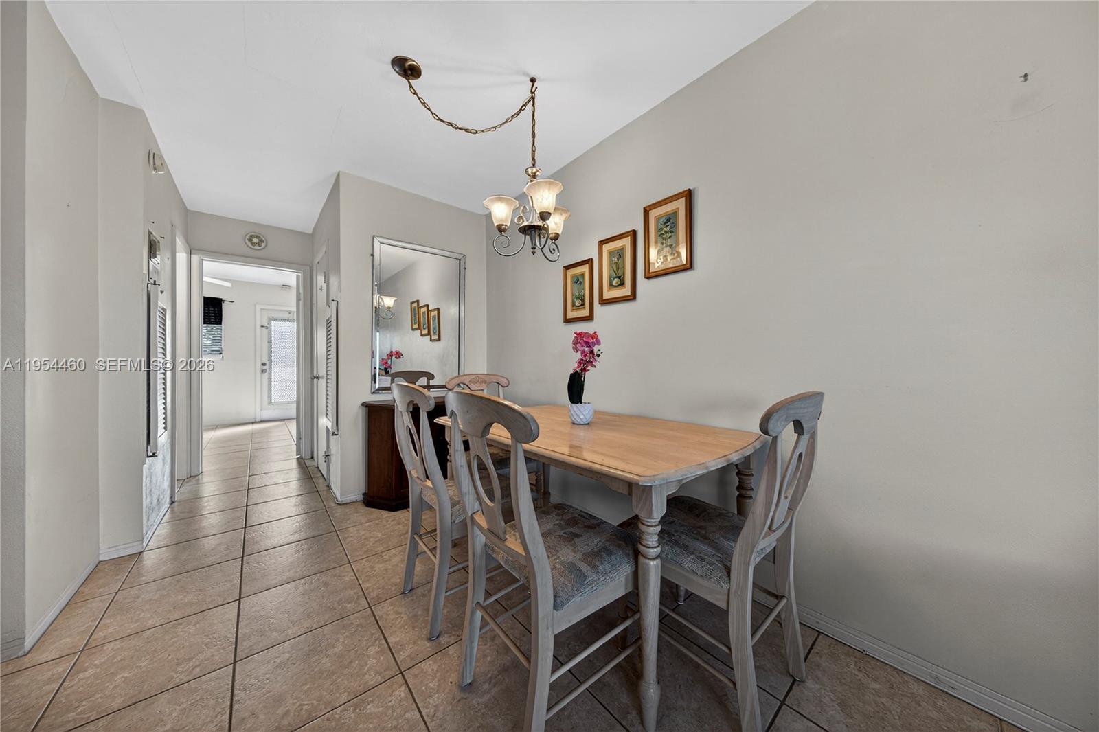 331 East McNab Road, Unit 226 Pompano Beach, FL 33060 - Photo 11 of 29 a view of a dining room with furniture