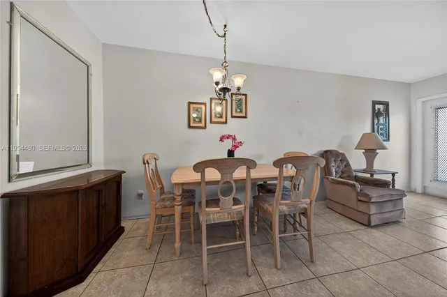 a kitchen with a sink and a refrigerator