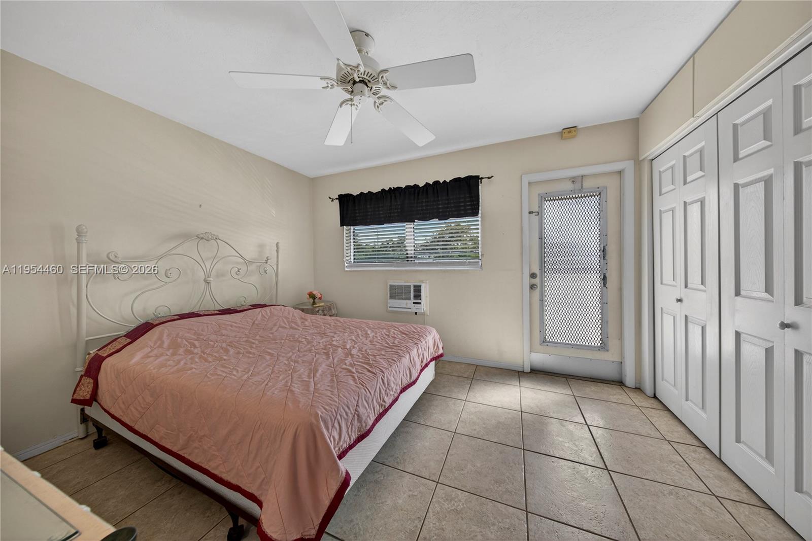 331 East McNab Road, Unit 226 Pompano Beach, FL 33060 - Photo 17 of 29 a bedroom with a bed and a window