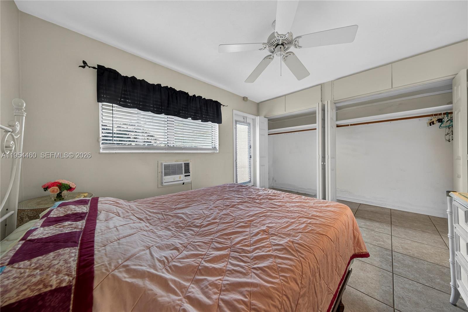 331 East McNab Road, Unit 226 Pompano Beach, FL 33060 - Photo 19 of 29 a bedroom with a bed and a window