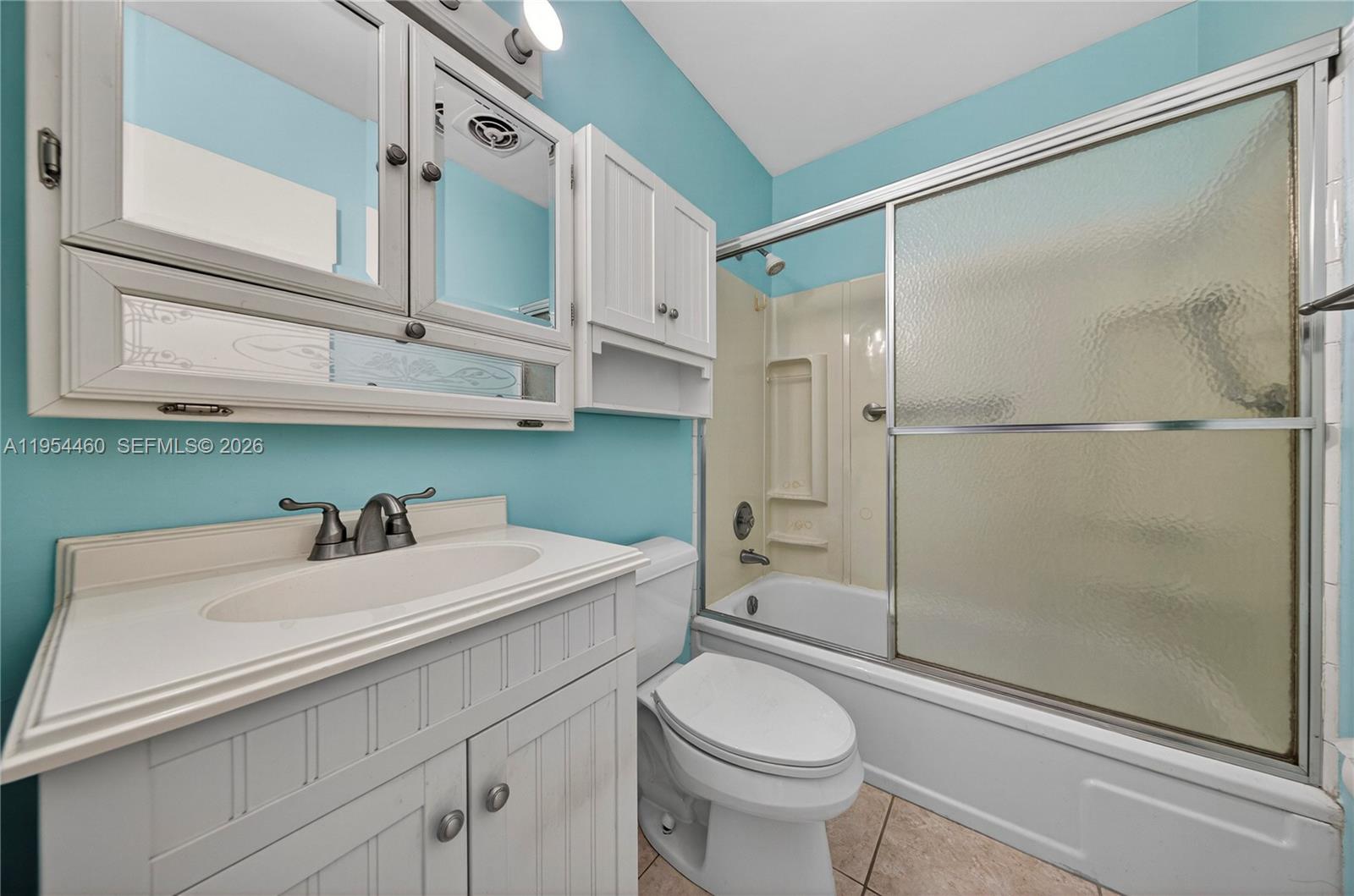 331 East McNab Road, Unit 226 Pompano Beach, FL 33060 - Photo 21 of 29 a bathroom with a sink toilet and shower