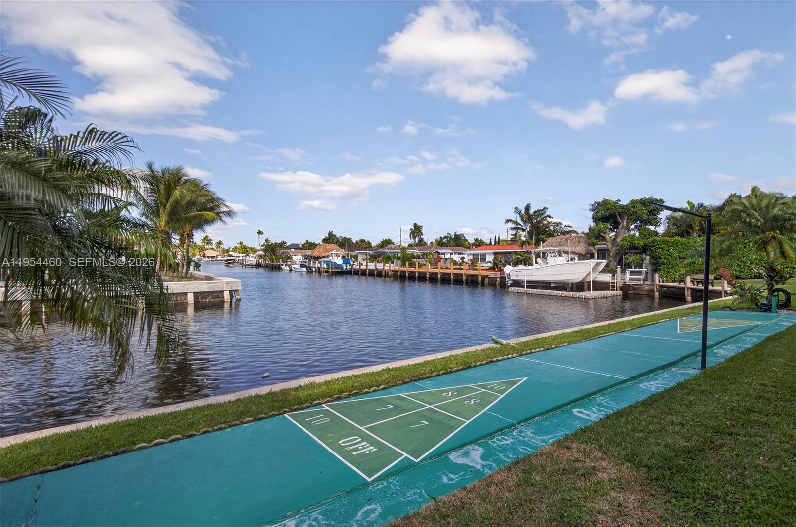 331 East McNab Road, Unit 226 Pompano Beach, FL 33060 - Photo 25 of 29 a view of a lake with houses in the background