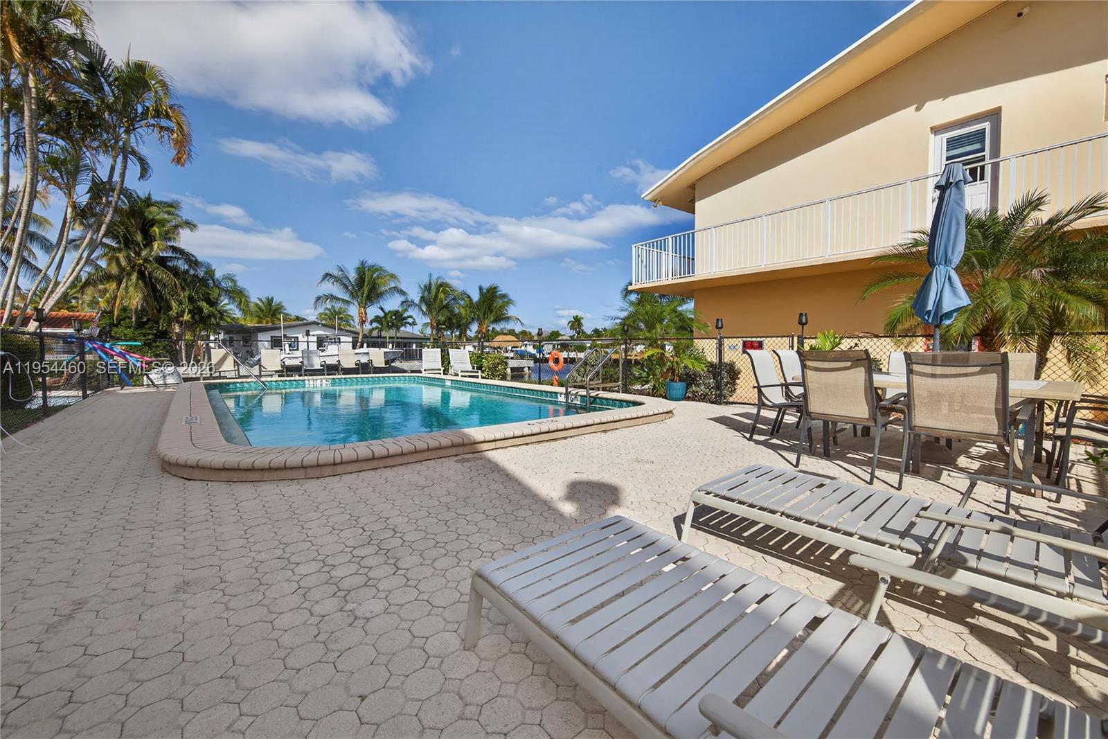 331 East McNab Road, Unit 226 Pompano Beach, FL 33060 - Photo 26 of 29 a view of a patio with swimming pool