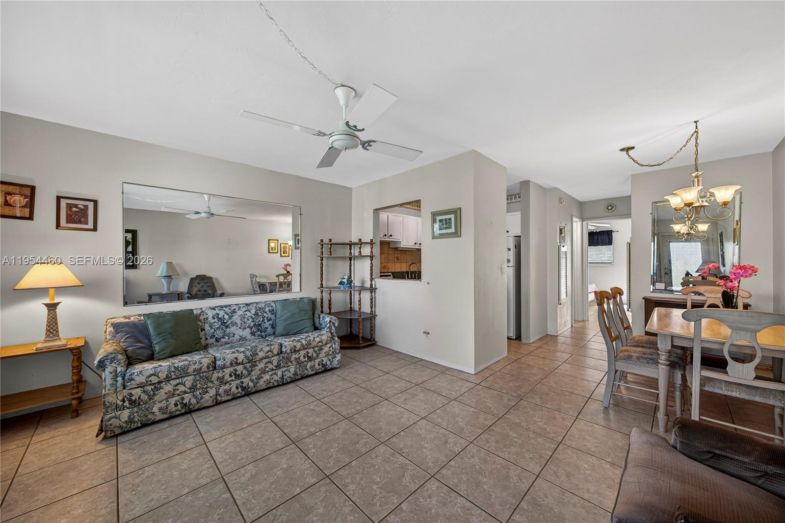 331 East McNab Road, Unit 226 Pompano Beach, FL 33060 - Photo 7 of 29 a living room with furniture and a dining table with kitchen appliances