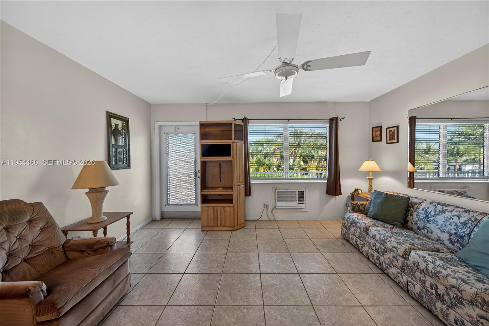 331 East McNab Road, Unit 226 Pompano Beach, FL 33060 - Photo 9 of 29 a living room with furniture and a window