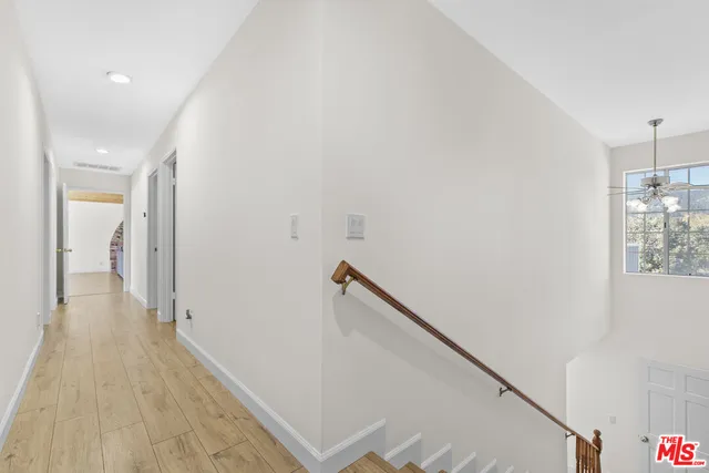 a living room with a bed and a window