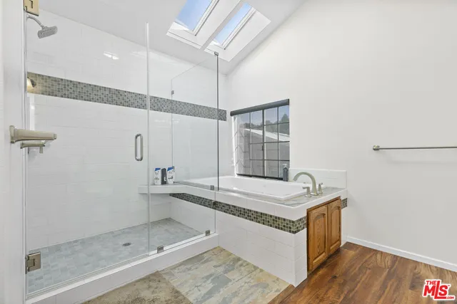 a backyard of a house with barbeque oven table and chairs