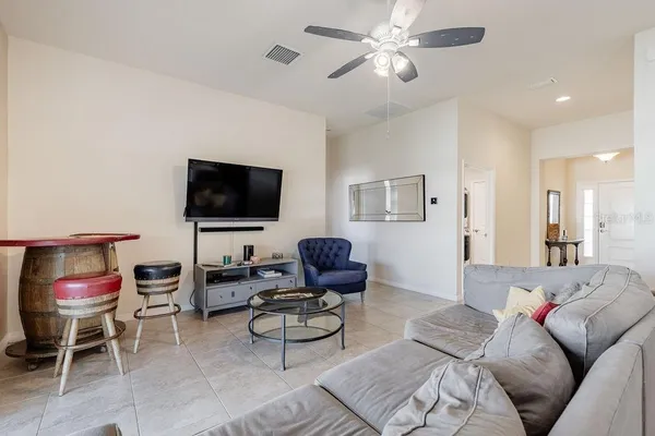 an aerial view of a house with a yard and lake view