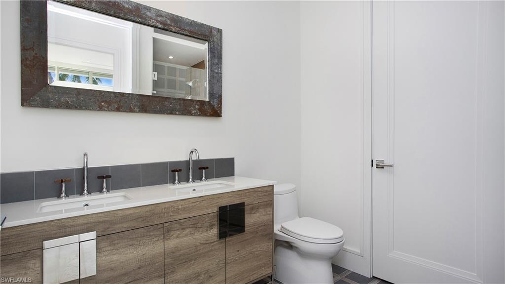 1798 Holiday Lane Naples, FL 34104 - Photo 20 of 47 Full bath with toilet and double vanity