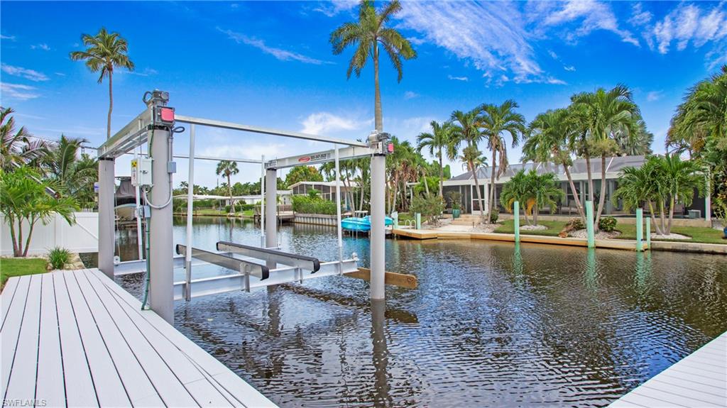 1798 Holiday Lane Naples, FL 34104 - Photo 34 of 47 Dock area featuring boat lift and a water view