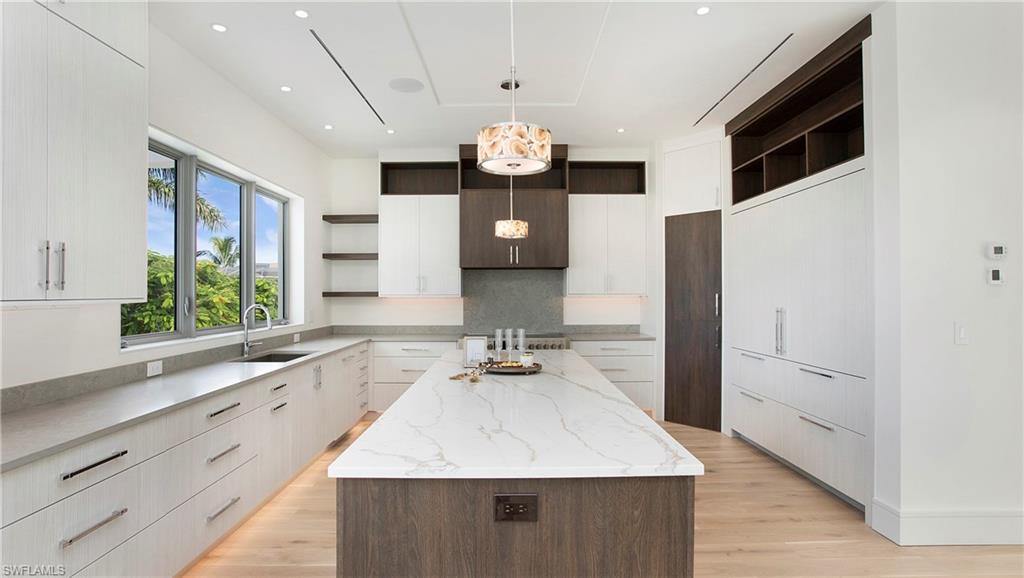 1798 Holiday Lane Naples, FL 34104 - Photo 10 of 47 Kitchen with open shelves, modern cabinets, a kitchen island, and recessed lighting