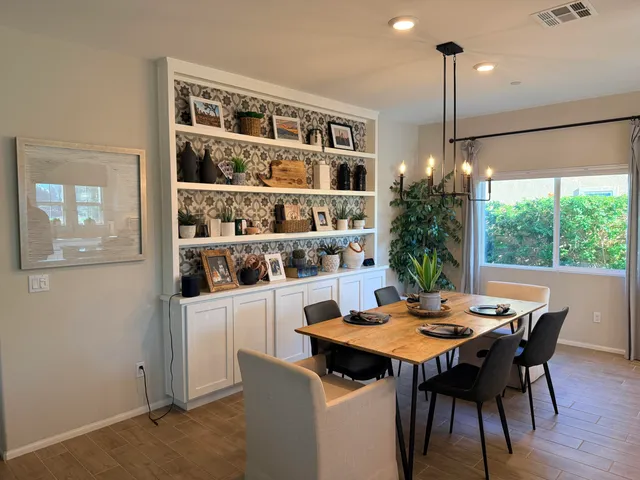 a view of a dining room with furniture window and wooden floor