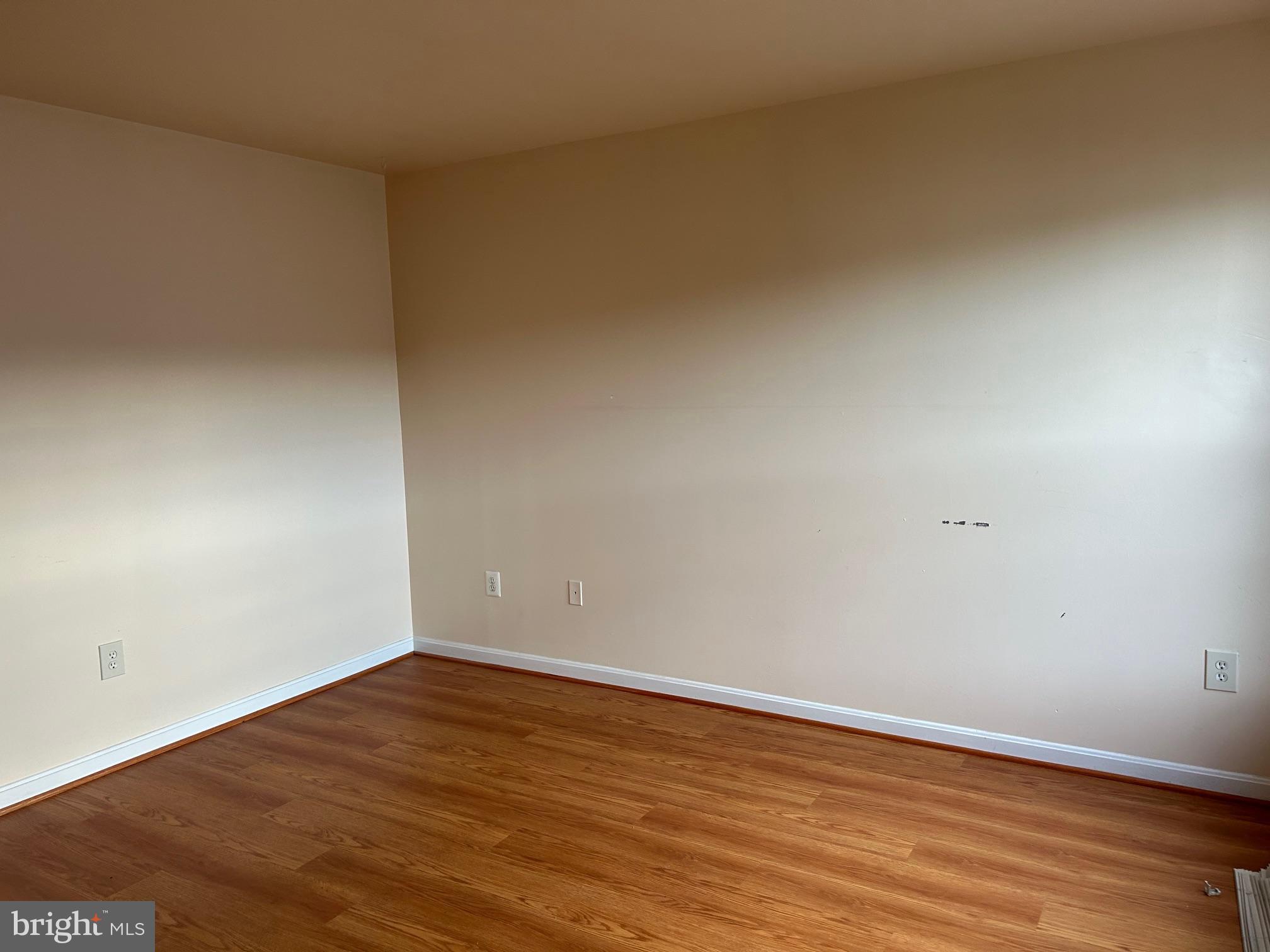 206 Arcadia Shores Circle Odenton, MD 21113 - Photo 9 of 15 a view of an empty room with wooden floor