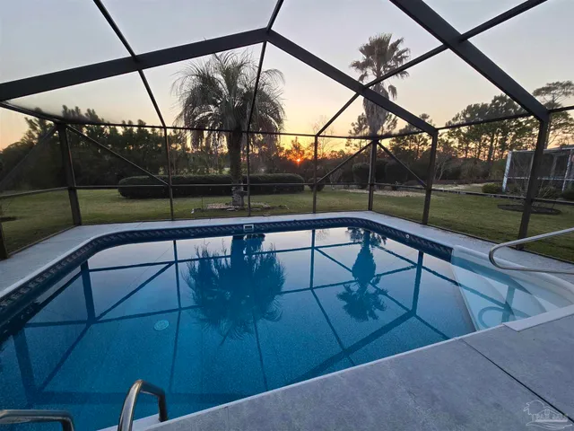a view of a swimming pool with a backyard