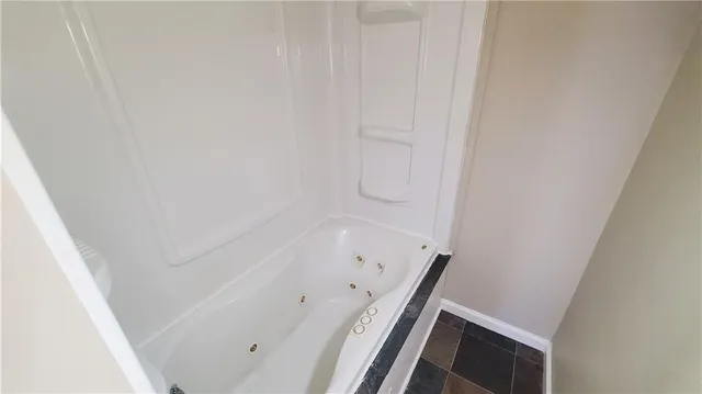 an empty room with wooden floor