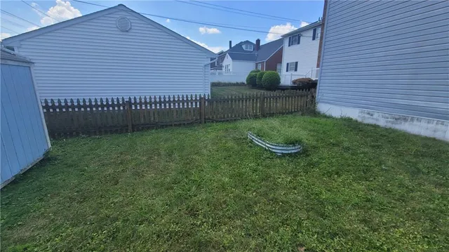 a view of a backyard with a garden