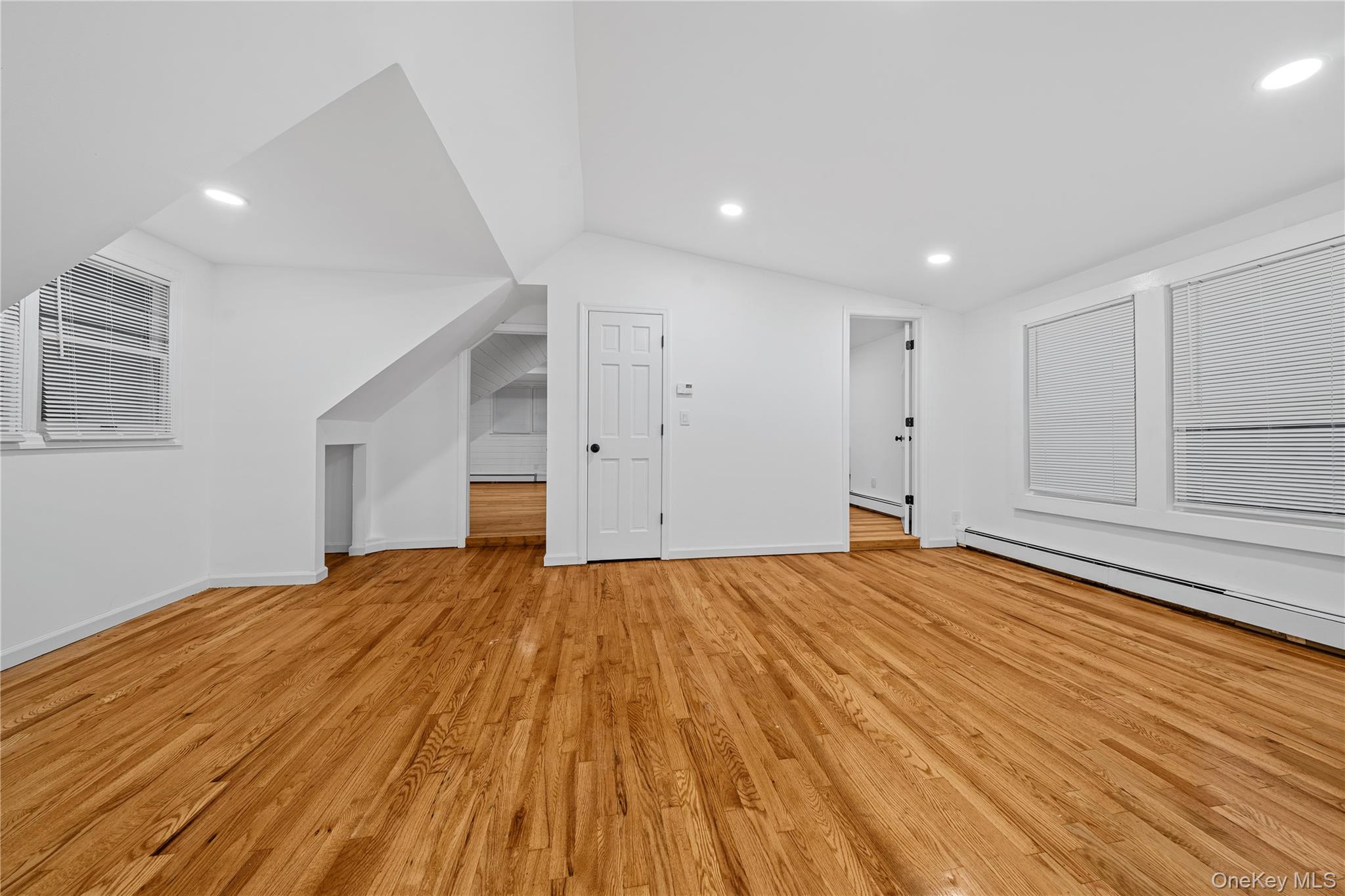 57 Eastwood Road Miller Place, NY 11764 - Photo 22 of 49 a big room with wooden floor and natural light