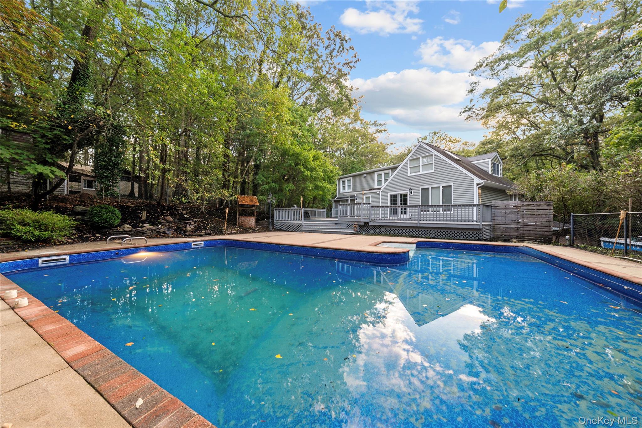 57 Eastwood Road Miller Place, NY 11764 - Photo 44 of 49 a view of a swimming pool with lounge chairs