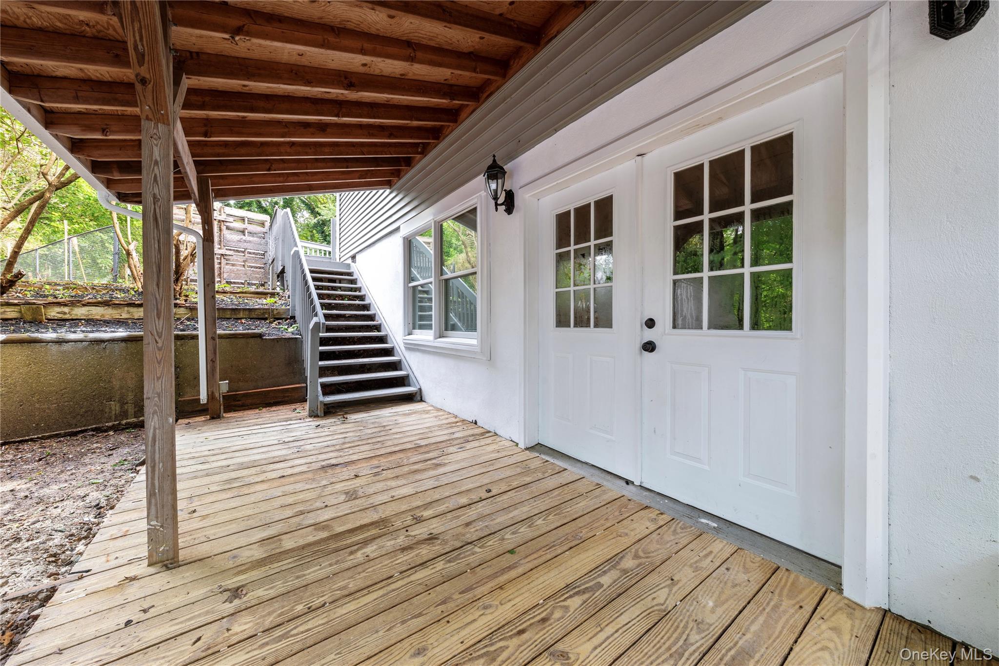 57 Eastwood Road Miller Place, NY 11764 - Photo 46 of 49 a view of a patio with wooden floor