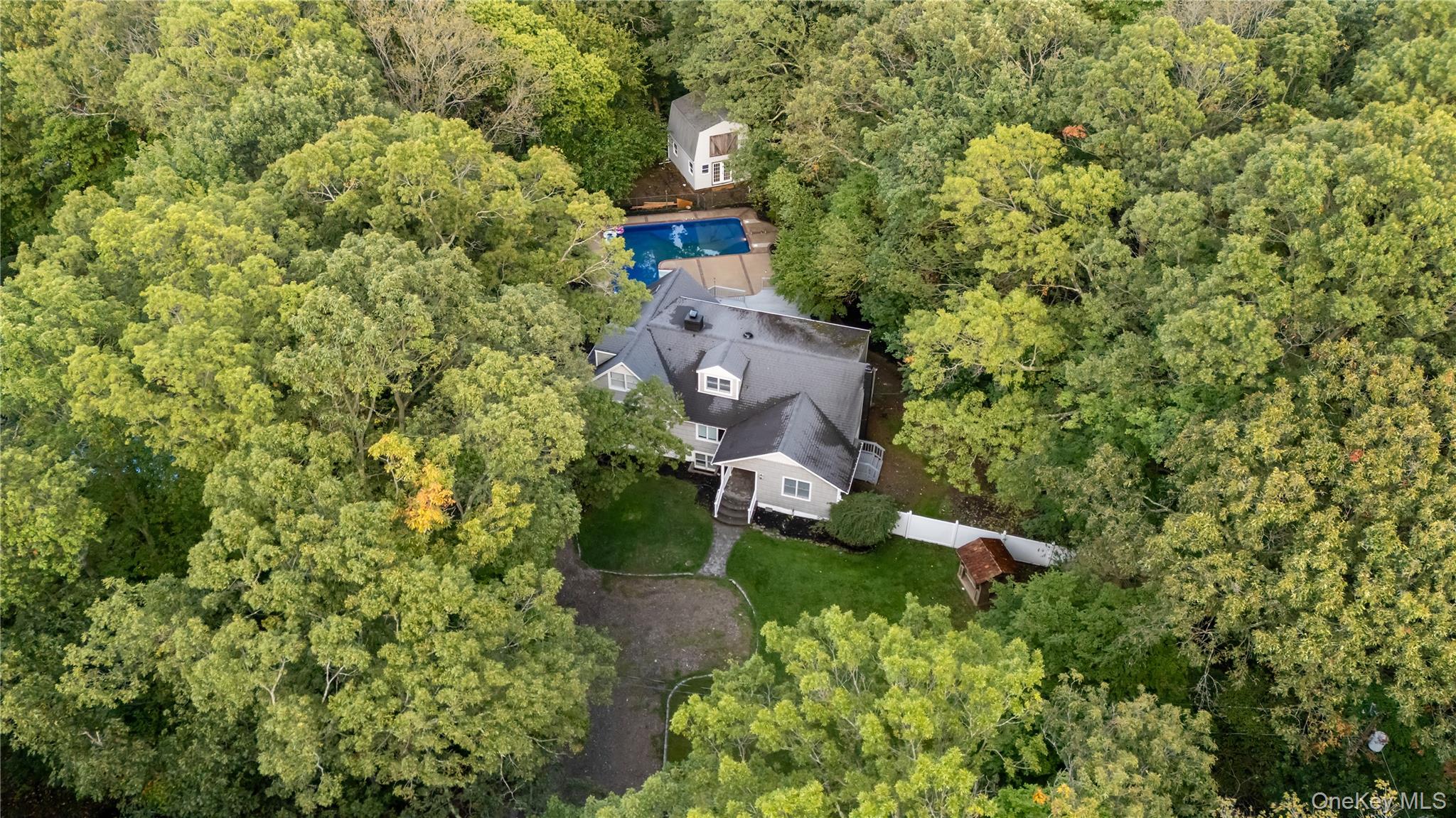 57 Eastwood Road Miller Place, NY 11764 - Photo 47 of 49 an aerial view of a house with yard swimming pool and outdoor seating